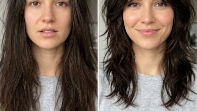 Edgy shaggy wolf cut featuring textured curtain bangs haircut, styled with dry texture spray for an effortless, rebellious look. Suitable for dark brunette to jet black hair.