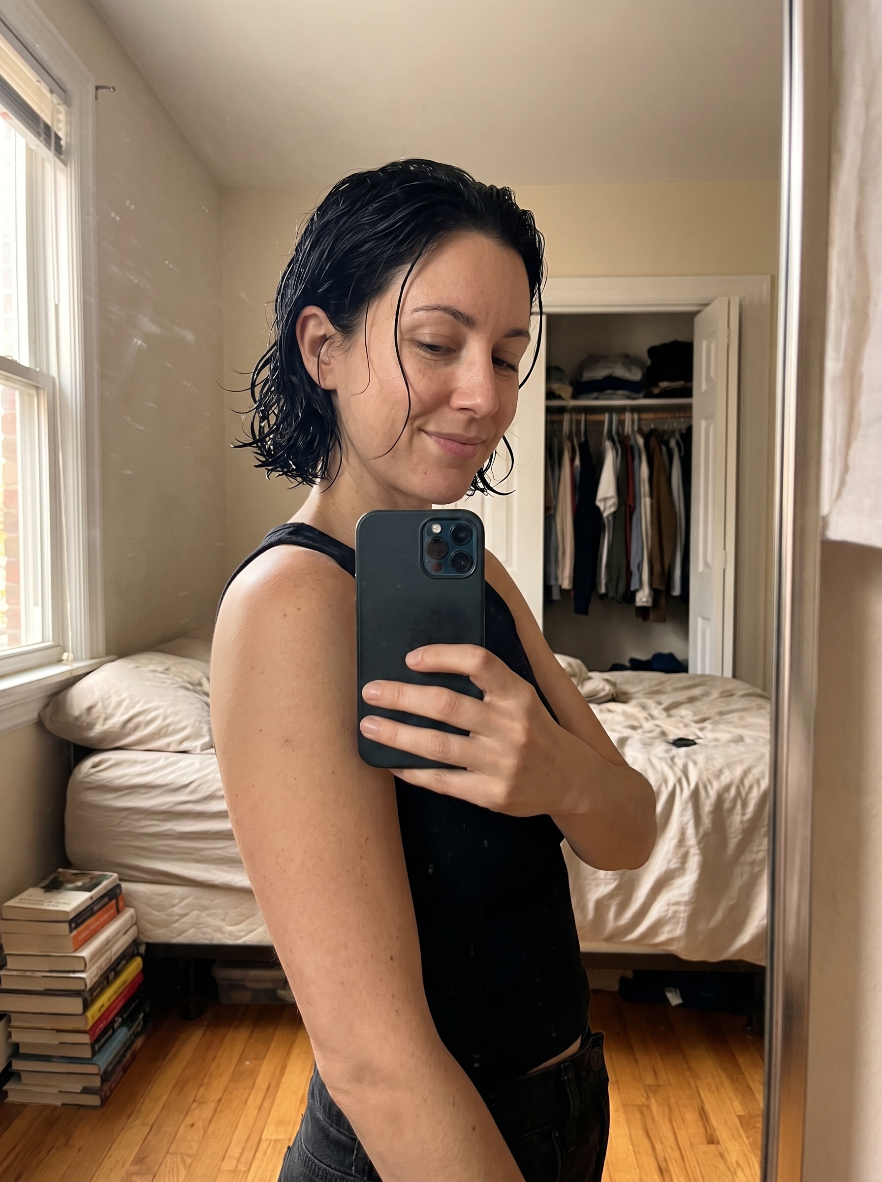 A fashion model showcasing 'The Oceanic Grunge Hydro-Bob' in Any Hair Color, an edgy and modern take on effortless summer hairstyles 2026. This sleek look is ideal for a night out or poolside chic, styled with high-shine gel and a fine-tooth comb.