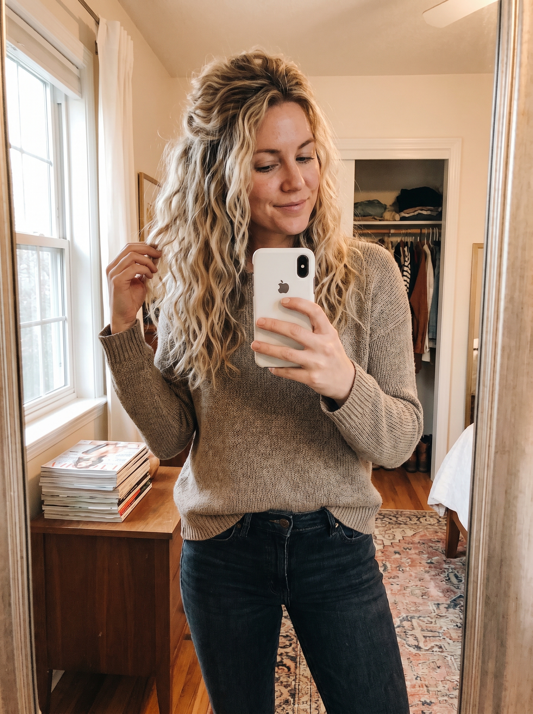 A model with an 'Oceanic Grunge Half-Up' hairstyle, featuring textured Natural Hair Color hair, perfect for effortless summer hairstyles 2026. This edgy, relaxed look is great for casual beach days, styled with sea salt spray and a silk scrunchie.