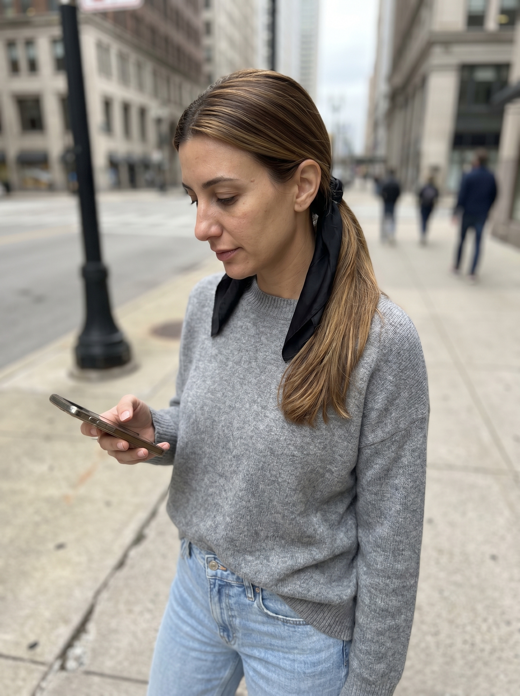 The luxurious 'Silk-Wrapped Pony with Syrup Brunette' hairstyle, a polished and elegant effortless summer hairstyle 2026 featuring a ponytail wrapped with a long silk scarf. Ideal for work, date nights, or resort wear, enhanced with shine-enhancing hair oil and anti-humidity sealant.