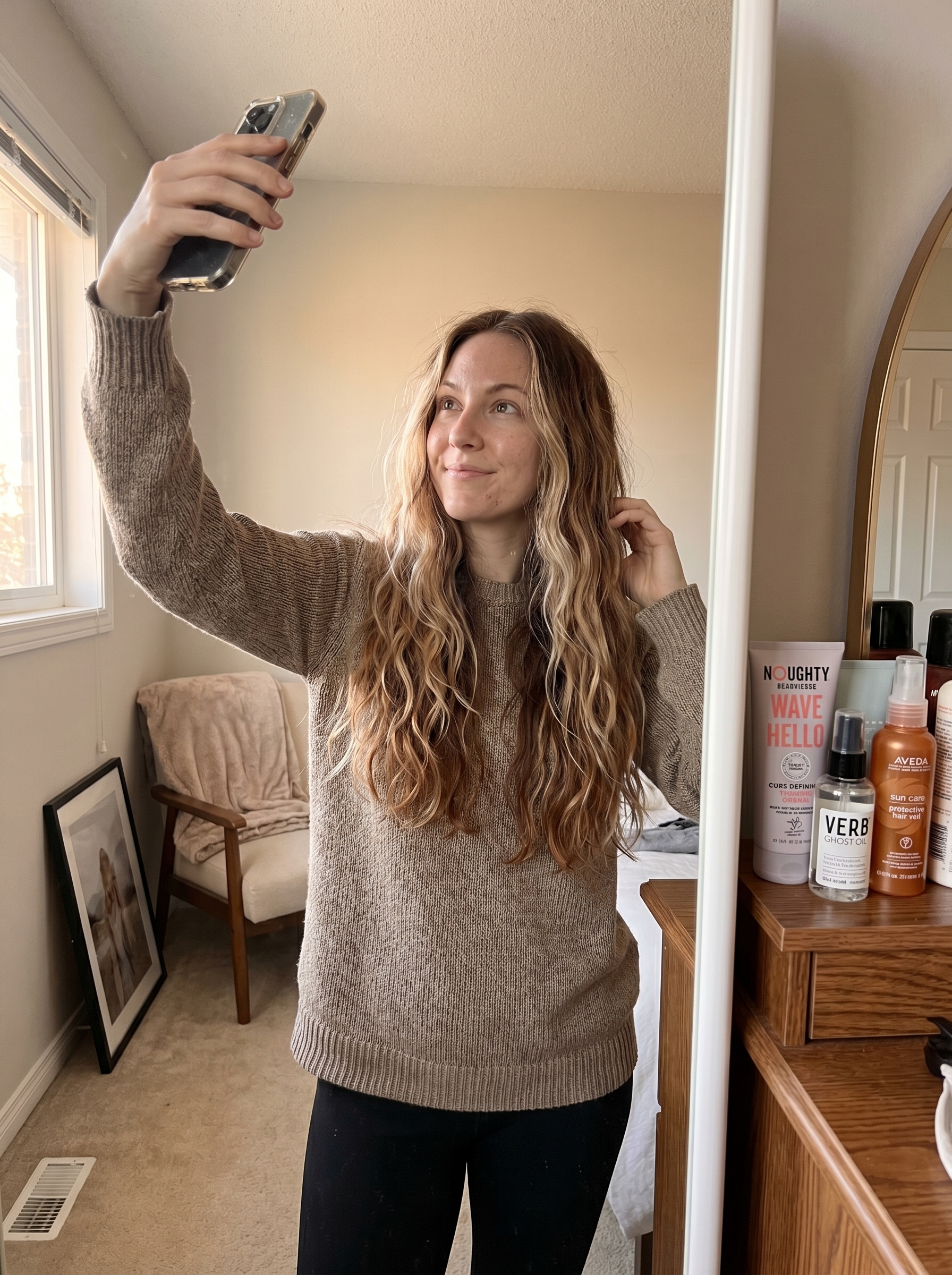 A back view showcasing 'U' Cut with Air-Dried Waves, a natural and effortless flattering summer haircut 2026. The healthy waves are enhanced with a wave-enhancing styling cream and protected by UV spray.