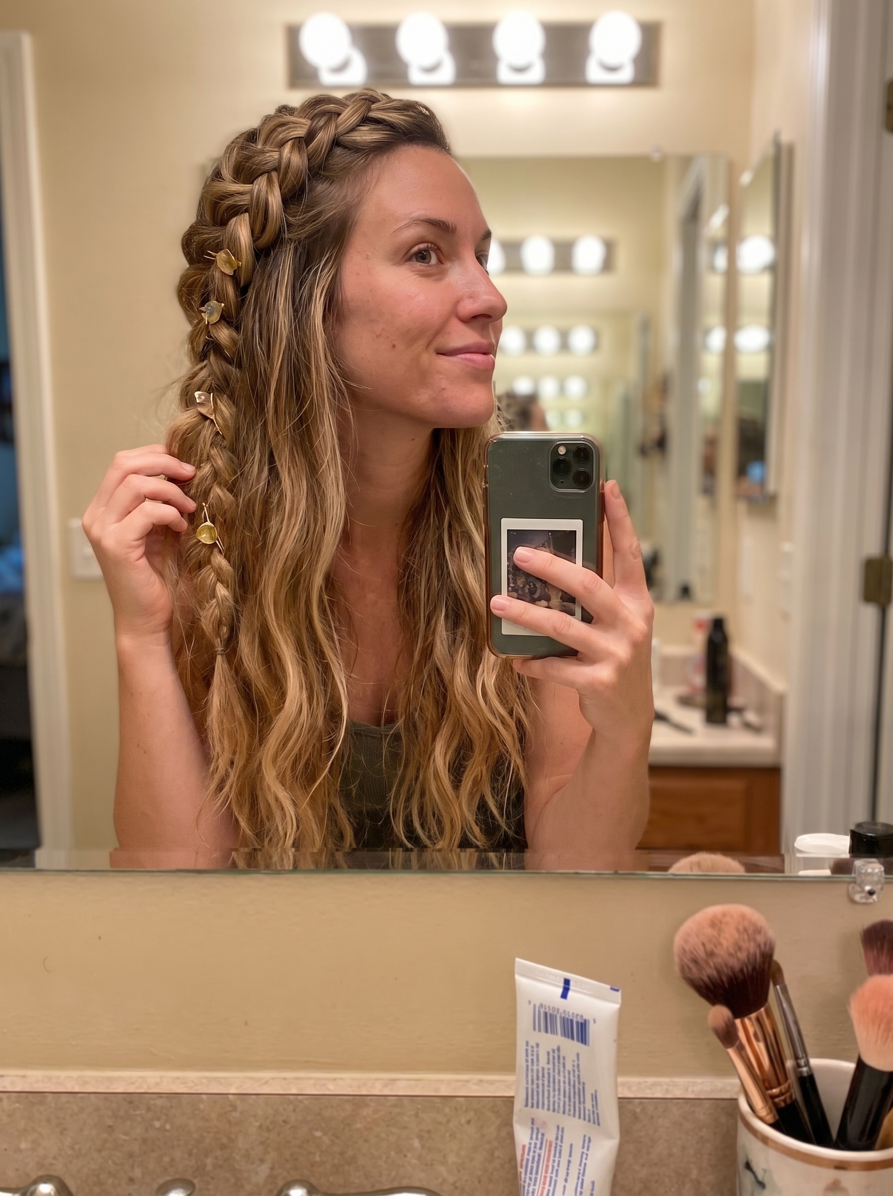 Bohemian braided half-up style with raw crystal hairpins for outdoor wedding hair summer 2026. Features lived-in balayage and apricot lowlights.