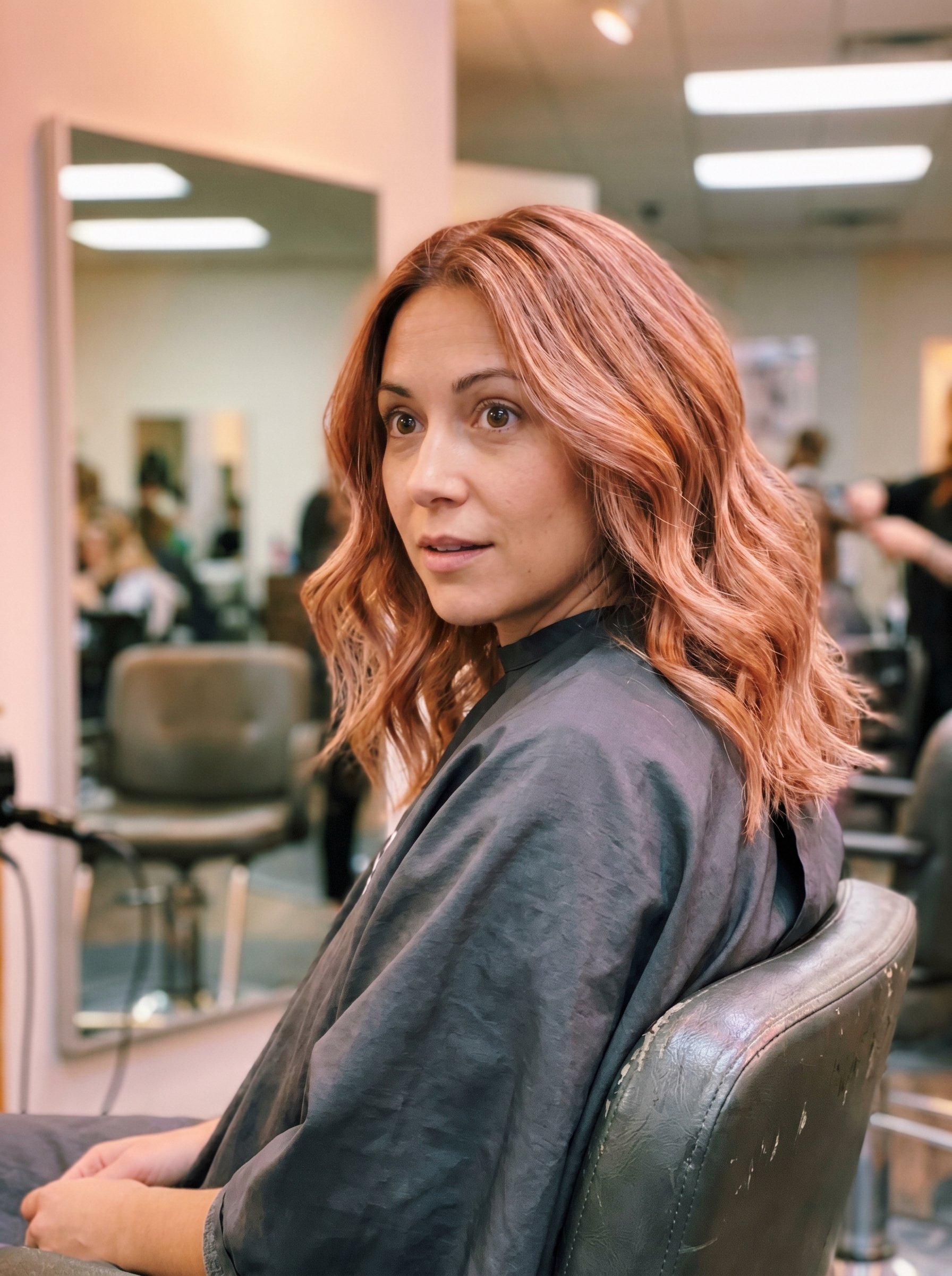 Ethereal sparkling rose gold gloss, a romantic and playful summer hair color option 2026, with soft pink, golden peach, and warm blonde tones, great for adventurous individuals.