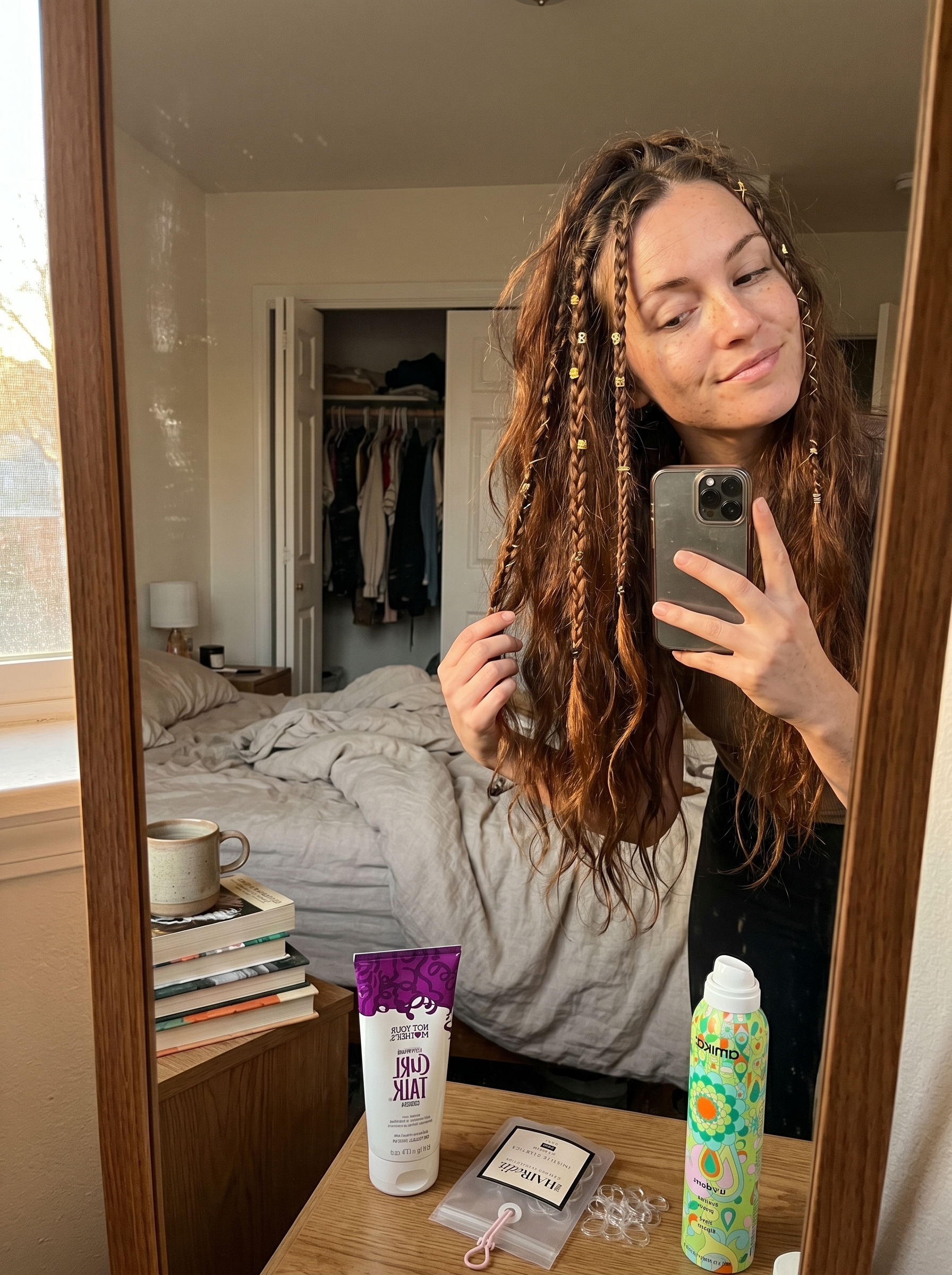 Boho Braids: Free-Spirited Summer Hair for Brunettes 2026 Boho braided tendrils mixed with diffused waves, showcasing a free-spirited summer hair for brunettes 2026 style. Features natural brunette with warm gold accents, styled with hair elastics and curl-enhancing cream for a playful look.