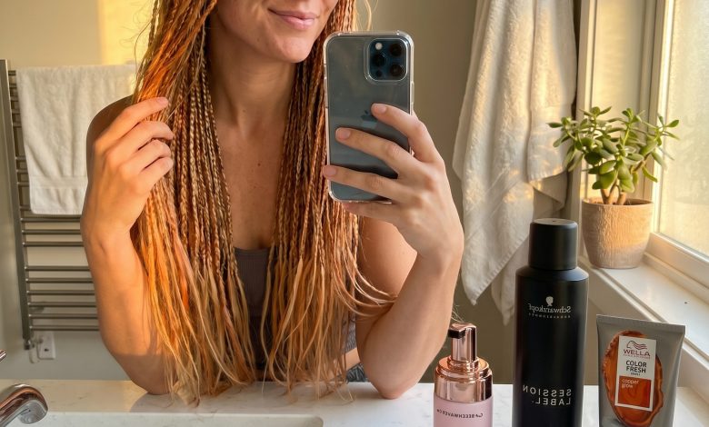 Romantic apricot crush highlighted baby braids on light blonde hair, featuring subtle copper tones. A whimsical and ethereal idea for summer hair ideas for blondes.