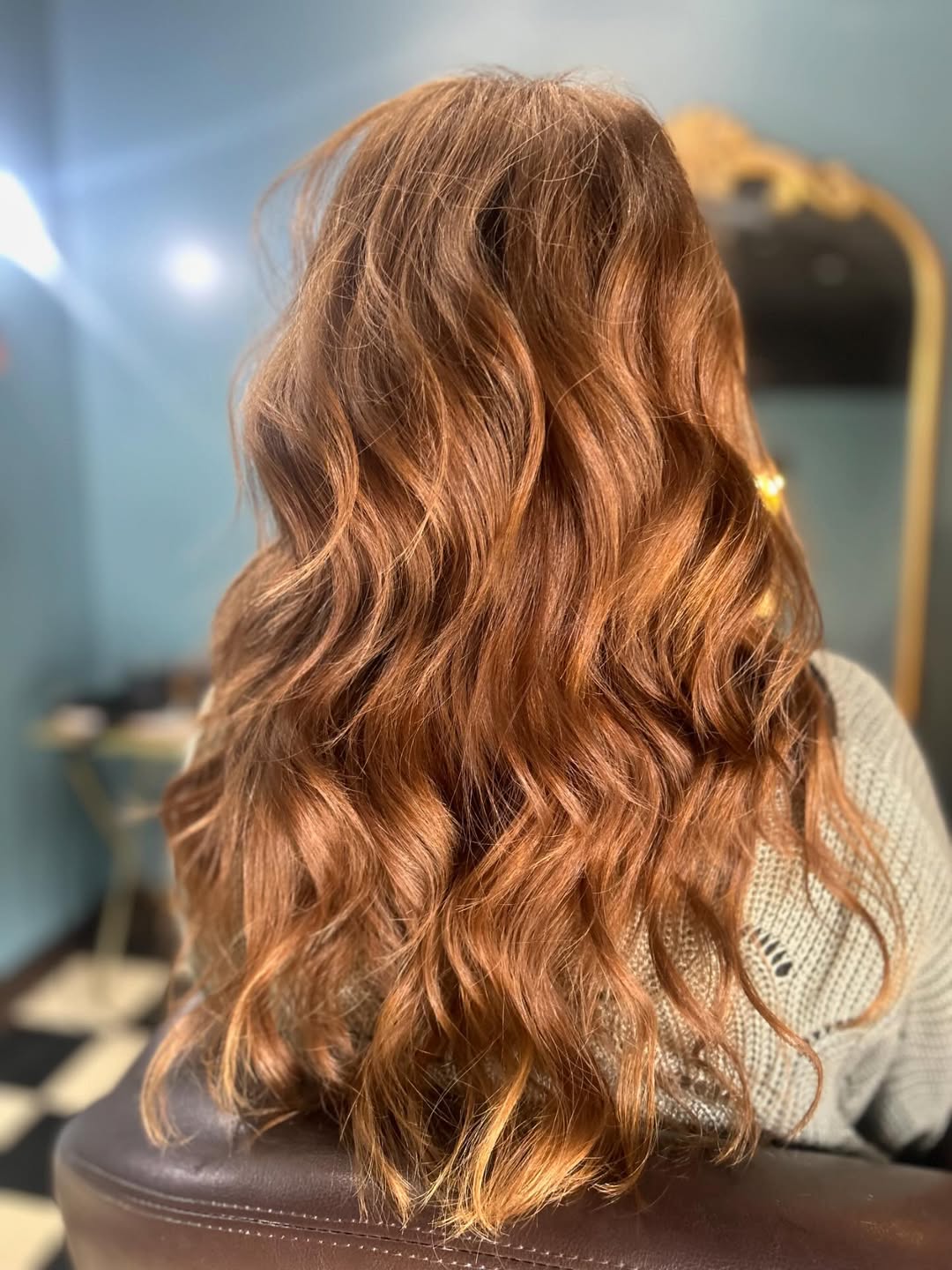 Close-up of a woman with a trendy, short blonde pixie cut, perfect for summer haircuts inspiration 2026. Her hair is casually tousled, highlighting textured layers and a modern, airy feel ideal for warm weather styling.