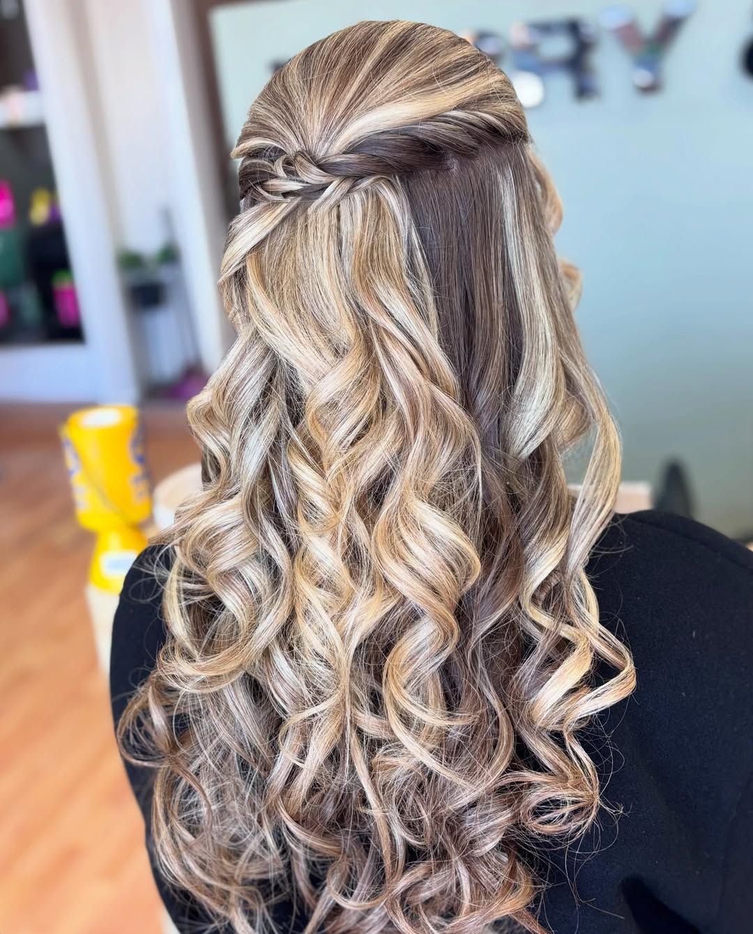 Close-up of a woman with a sleek high ponytail, a top summer hairstyle 2026, showcasing defined texture and minimal flyaways for a chic look.