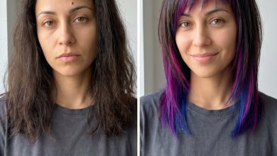 An edgy 'Bio-Glitch Asymmetrical Fringe with Vivid Peek-a-boos', a bold and experimental trendy haircut for summer 2026. Features neon green/pink/blue semi-permanent colors peeking through a natural base fringe, perfect for festivals or creative events.