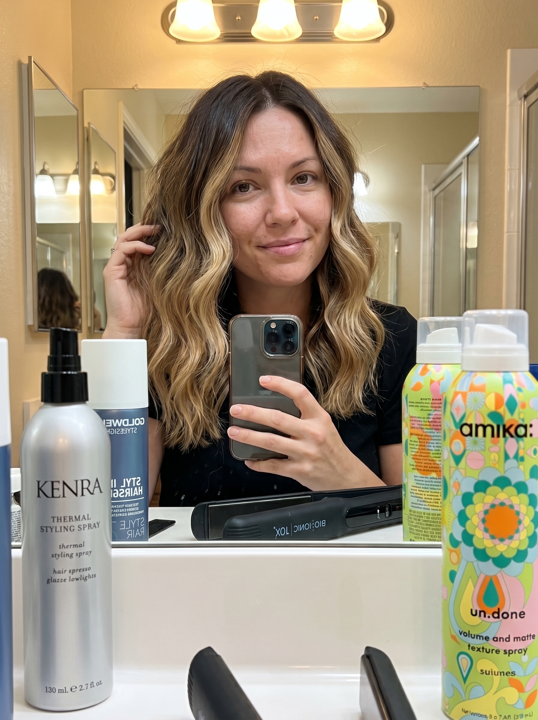 An effortless 'Scandi-Wave with Reverse Balayage', a trendy haircut for summer 2026. The natural brunette hair features warm blonde lowlights, creating a cool, undone look perfect for everyday wear, casual dates, or brunch. Styled with texturizing spray and a flat iron.