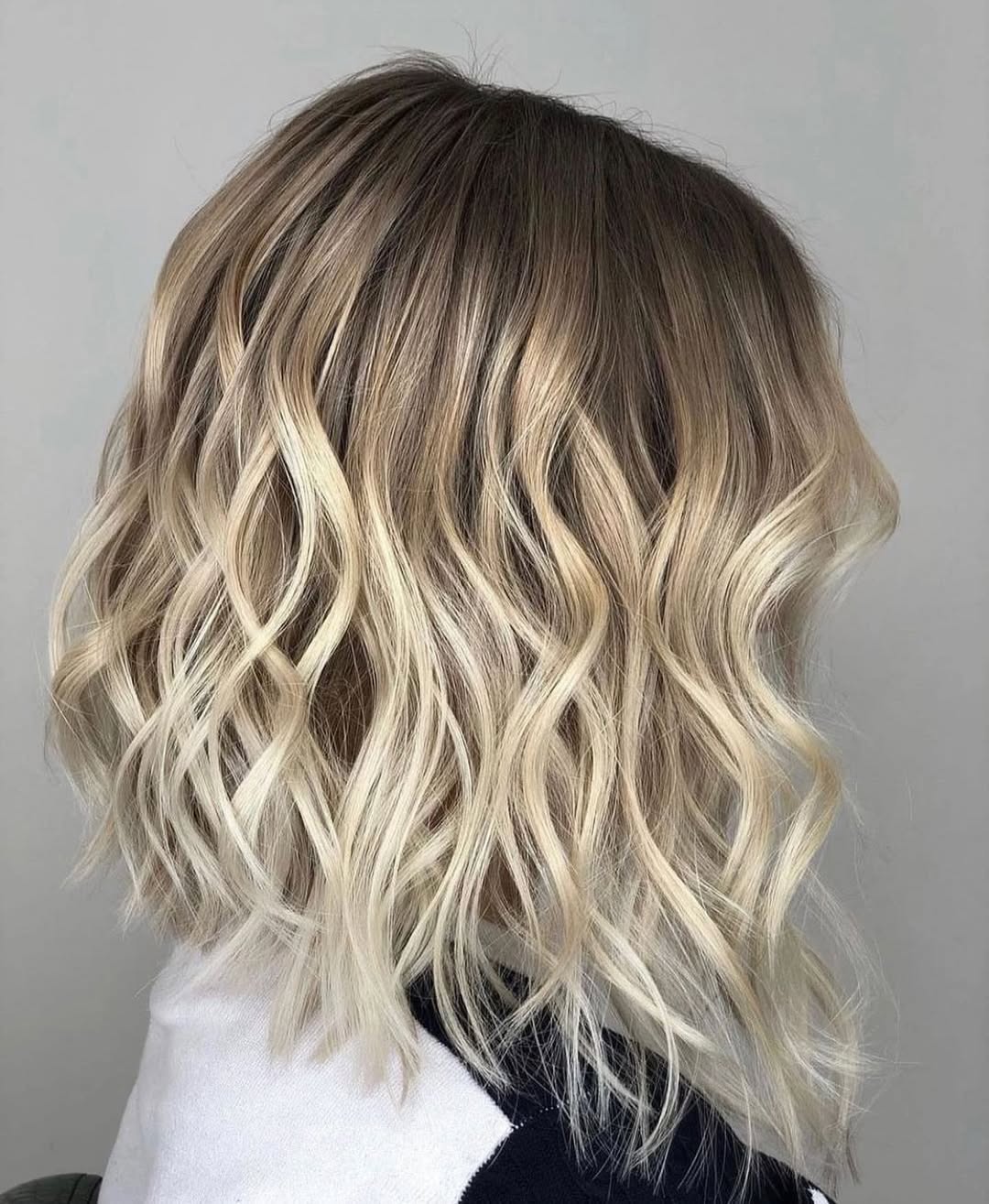 Trendy blonde layered bob with bright highlights, a chic option for women haircuts summer 2026. Perfect for a casual day or evening out.