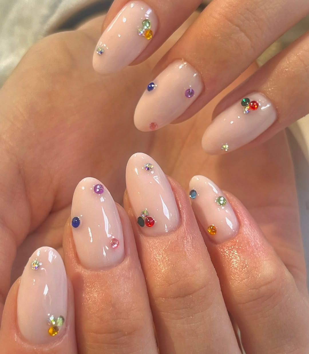 Barely There Nude Oval Nails With Rainbow Rhinestones