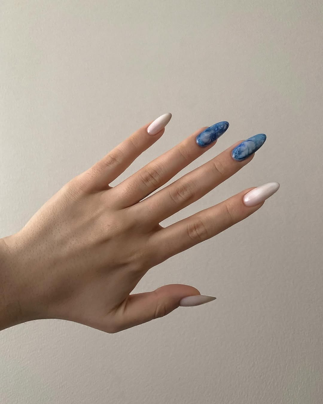 Blue Marble Swirl Almond Nails With White Gloss