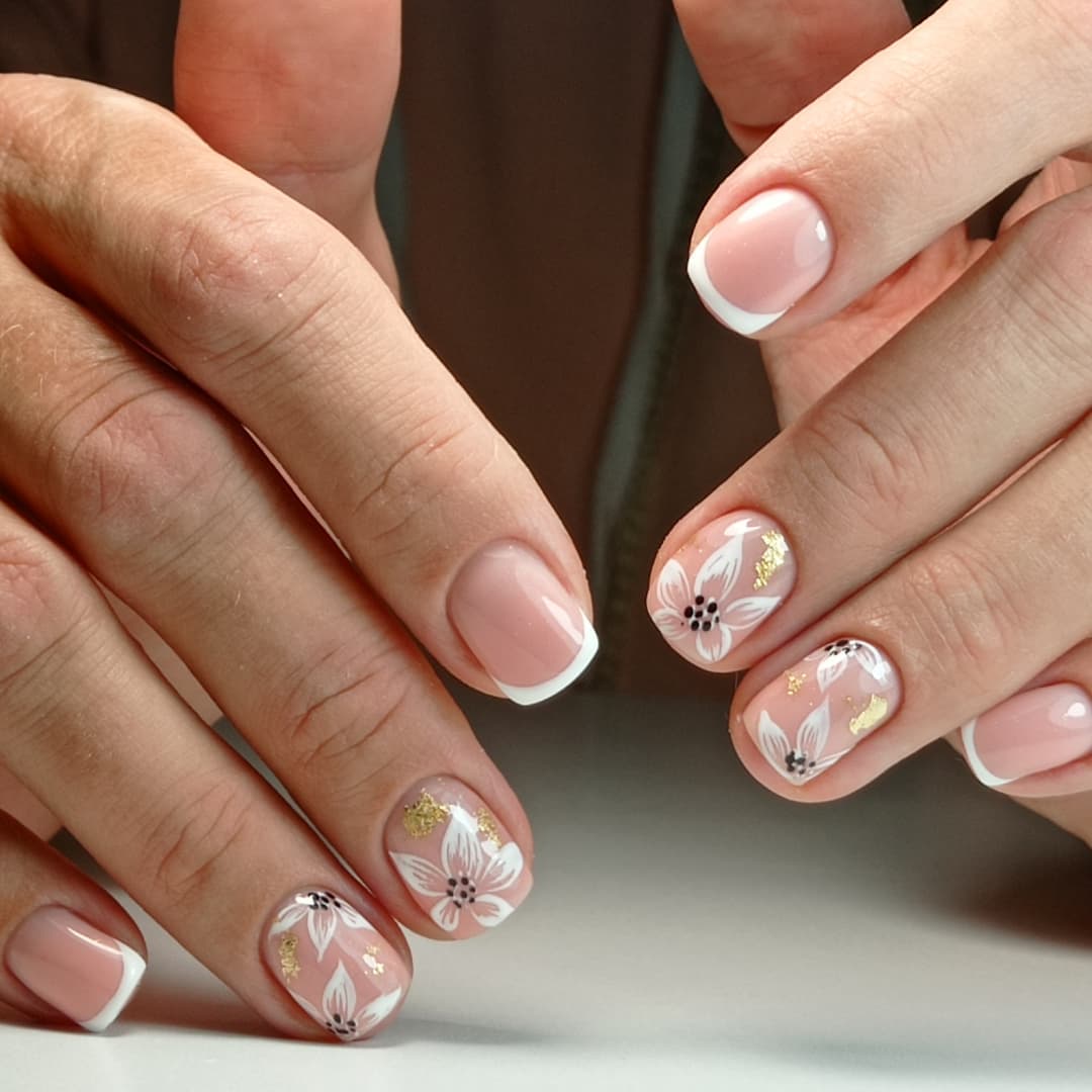 Blush French Tips with Golden Floral Accent Nails