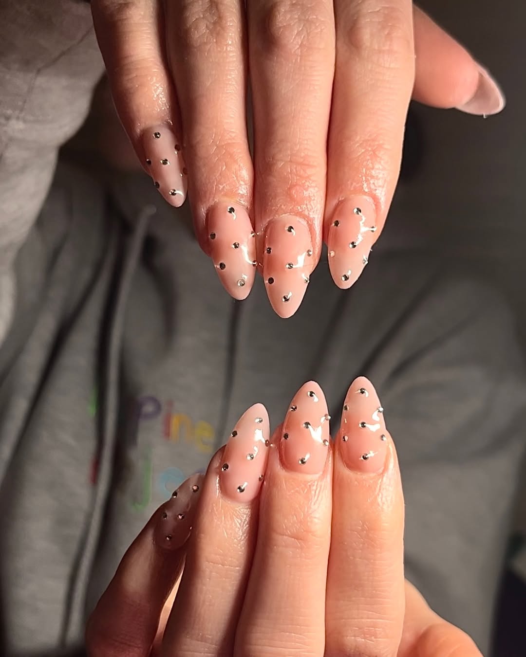 Clear Nude Almond Nails With Scattered Rhinestones