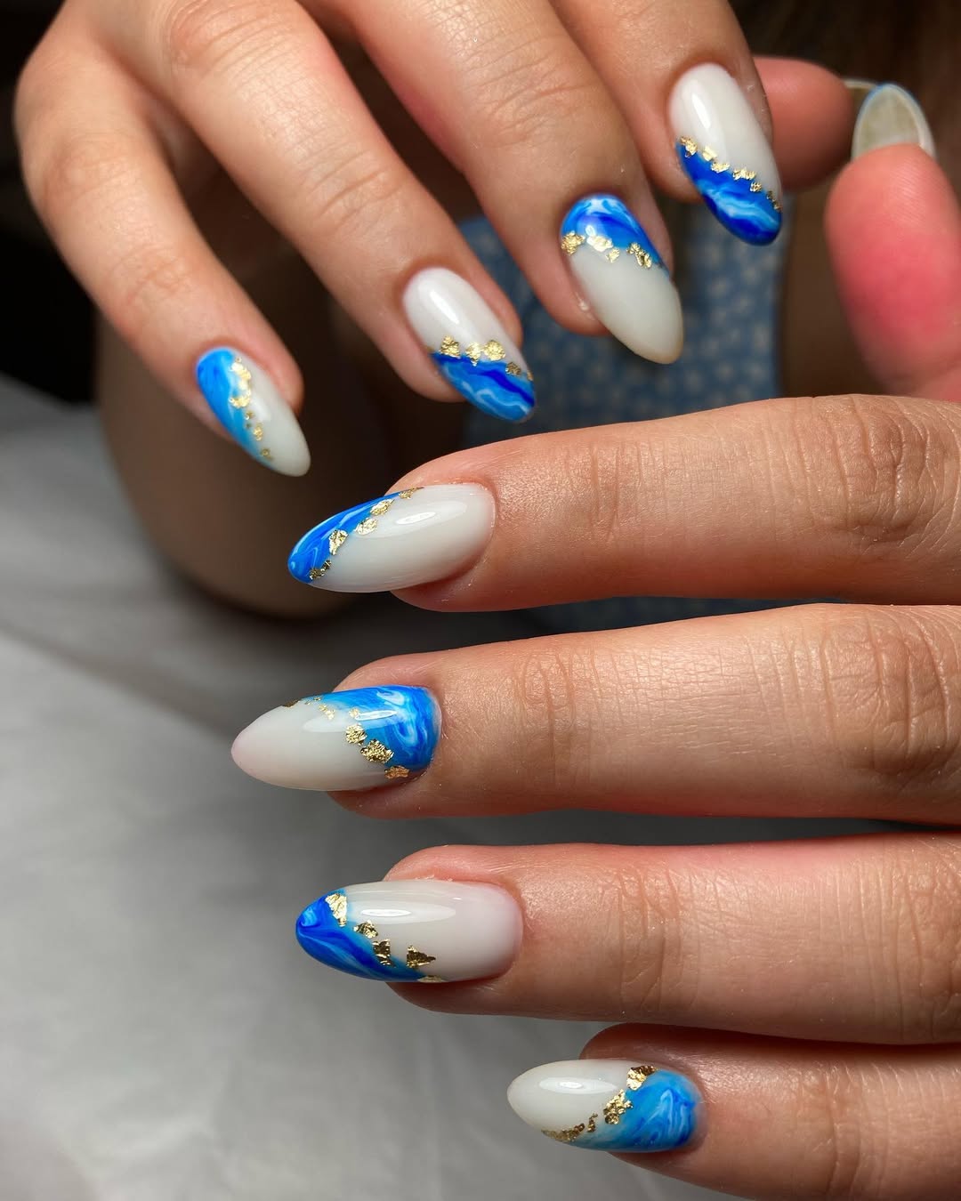 Coastal Blue White Marble Almond Nails With Gold Flakes