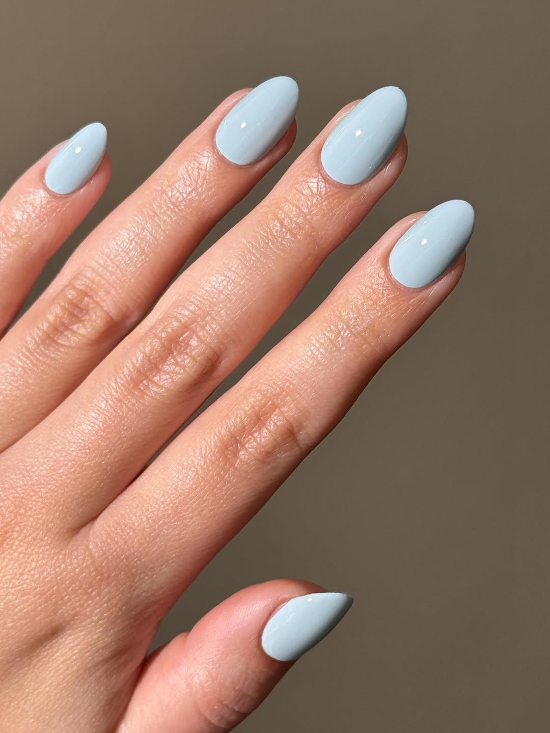 Glossy Pastel Blue Almond Nails