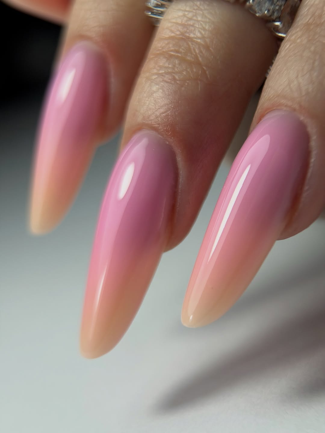 Glossy Pink to Peach Ombré Stiletto Nails