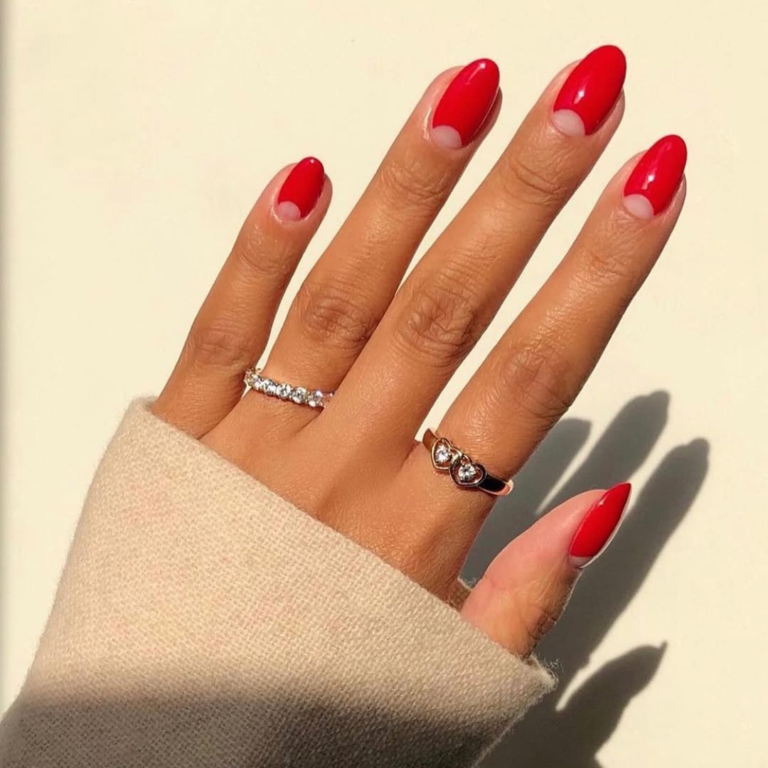 Glossy Red Negative Space Almond Nails