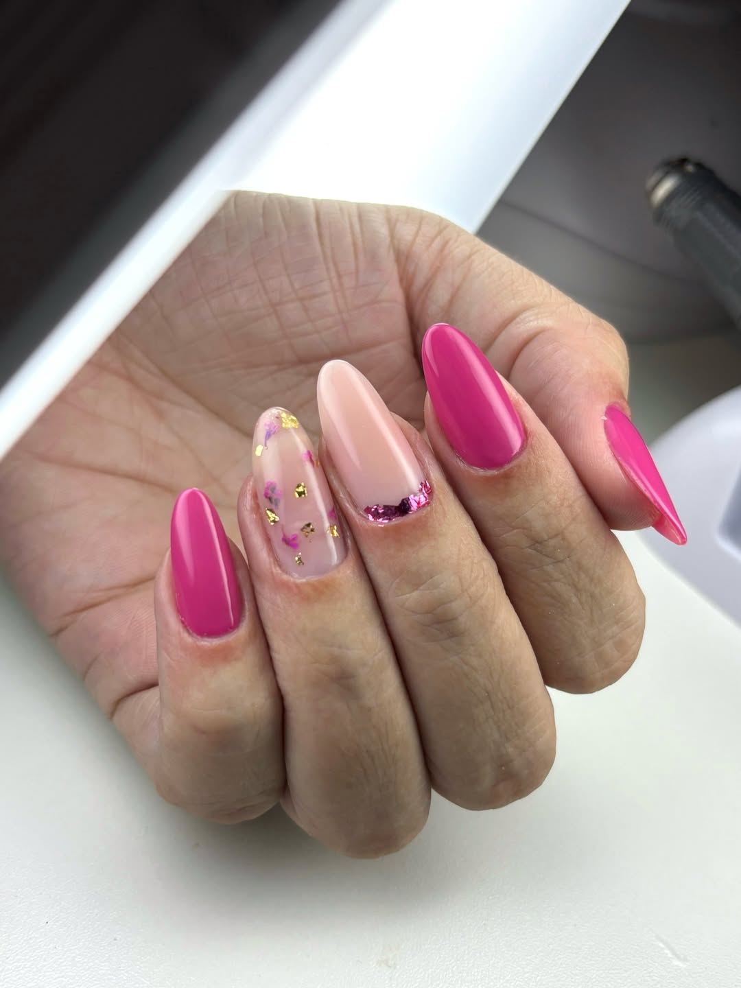 Hot Pink Almond Nails With Gold Flakes