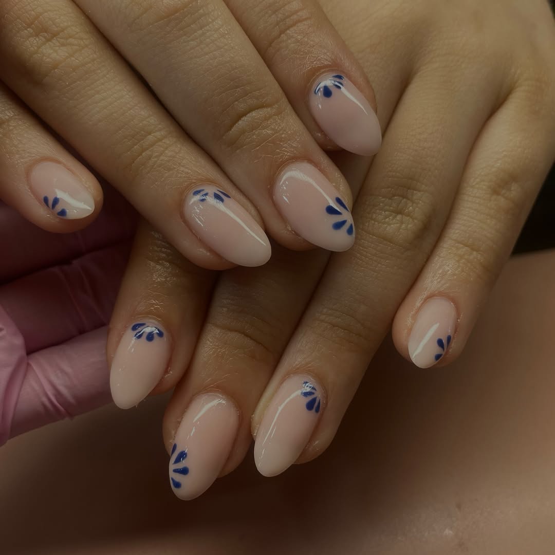 Milky Pink Nails With Abstract Blue Half Moons