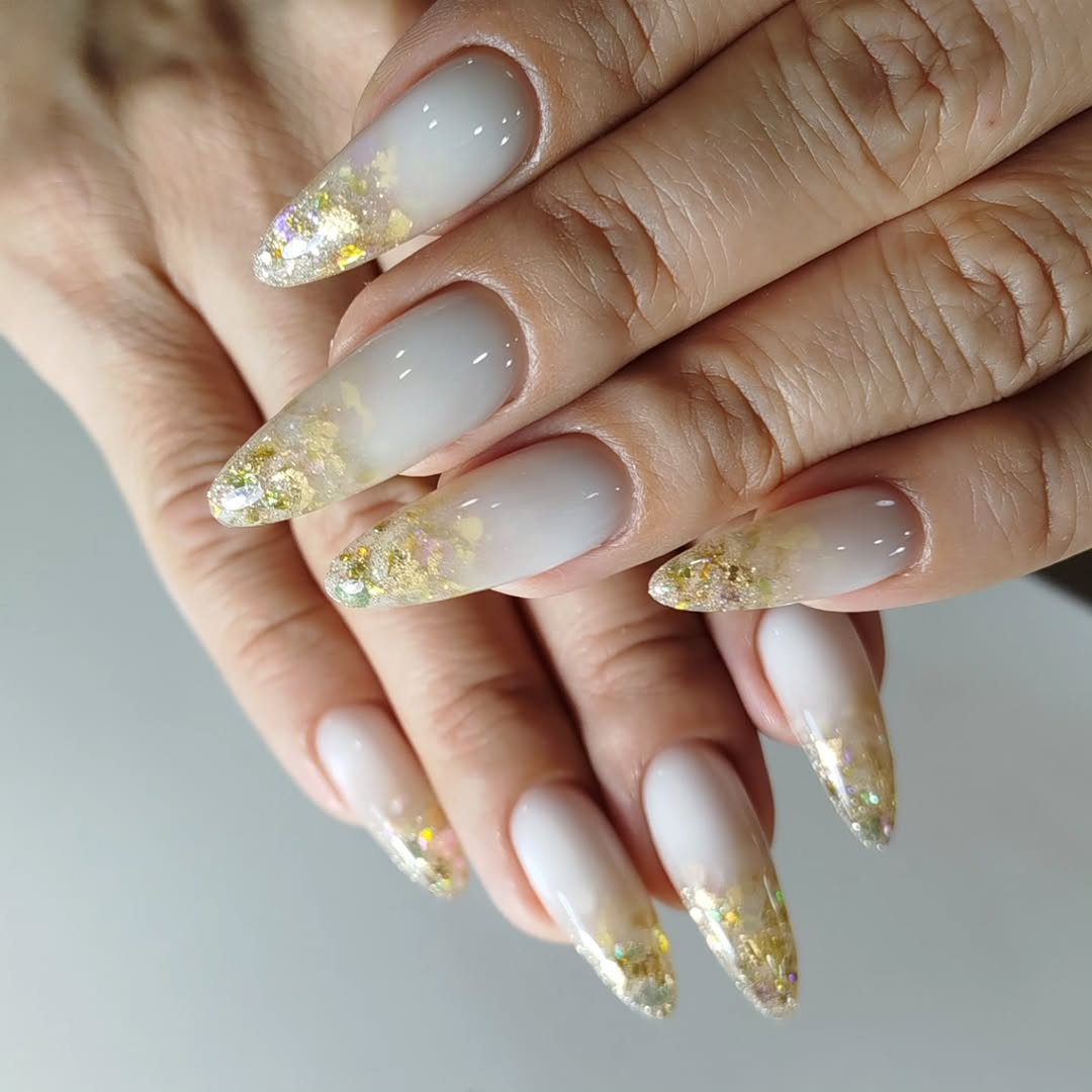 Milky White Fade with Gold Glitter Ombre Stiletto Nails