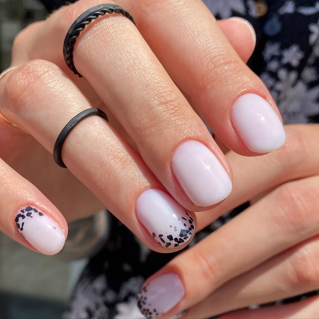 Milky White Nails with Abstract Black Glitter Tips
