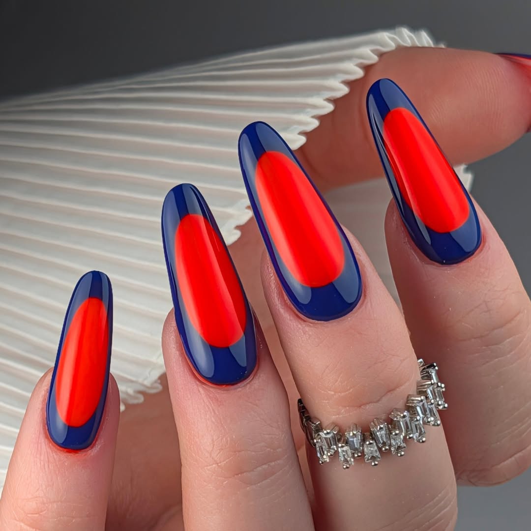 Navy Blue Oval Outline Neon Orange Nails