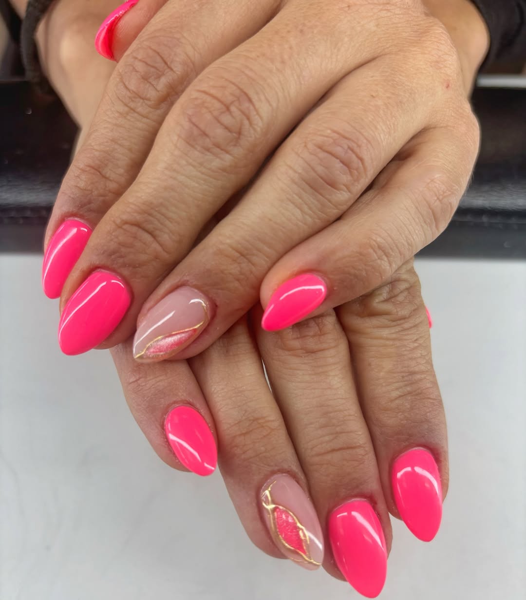 Neon Pink and Nude Gold Swirl Almond Nails