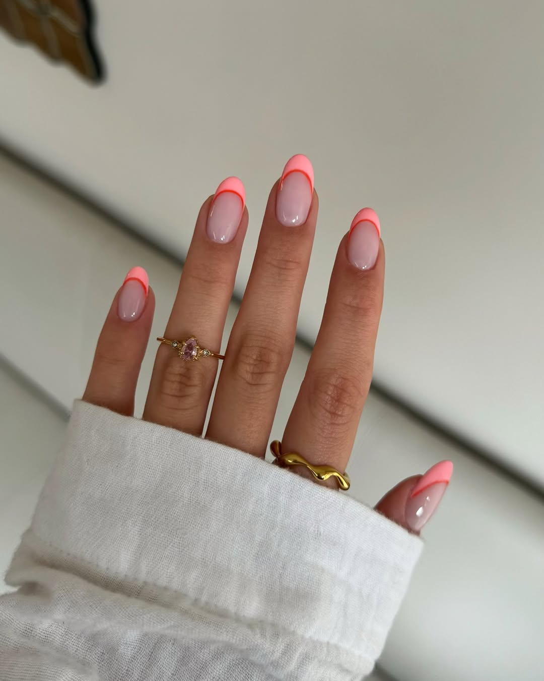 Neon Pink French Tip Almond Nails with Red Outline