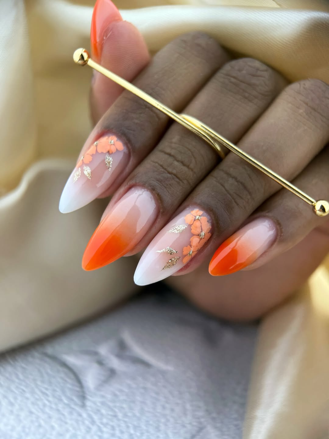 Orange Ombré Almond Nails with Floral Gold Accents
