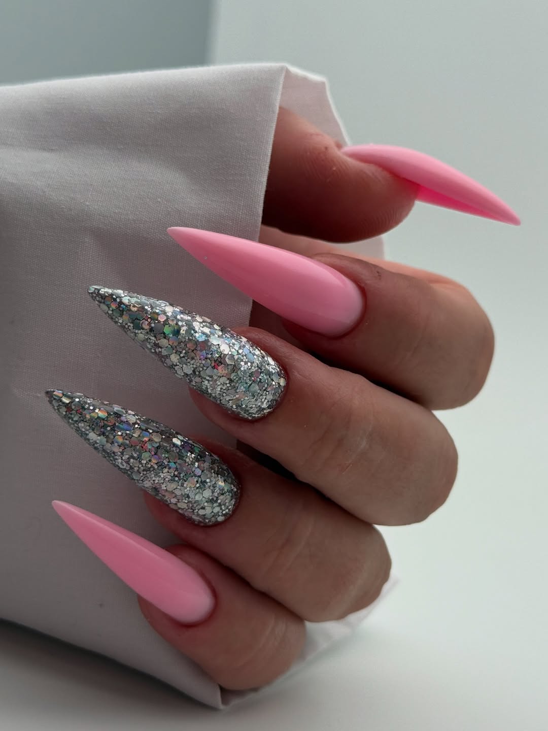 Pink Stiletto Nails with Holographic Glitter Accent