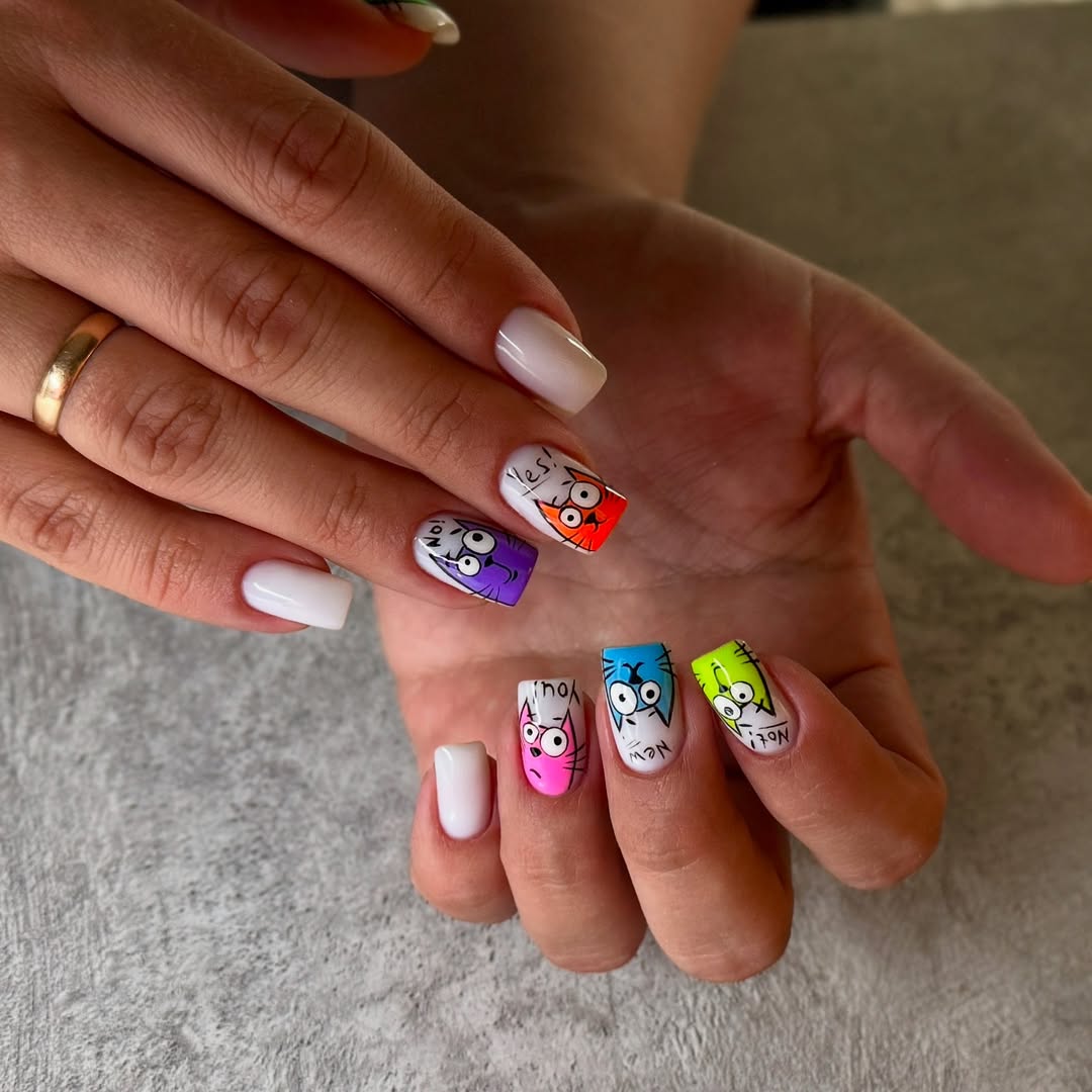 Playful Cartoon Cat Character Nails With Neon Accents
