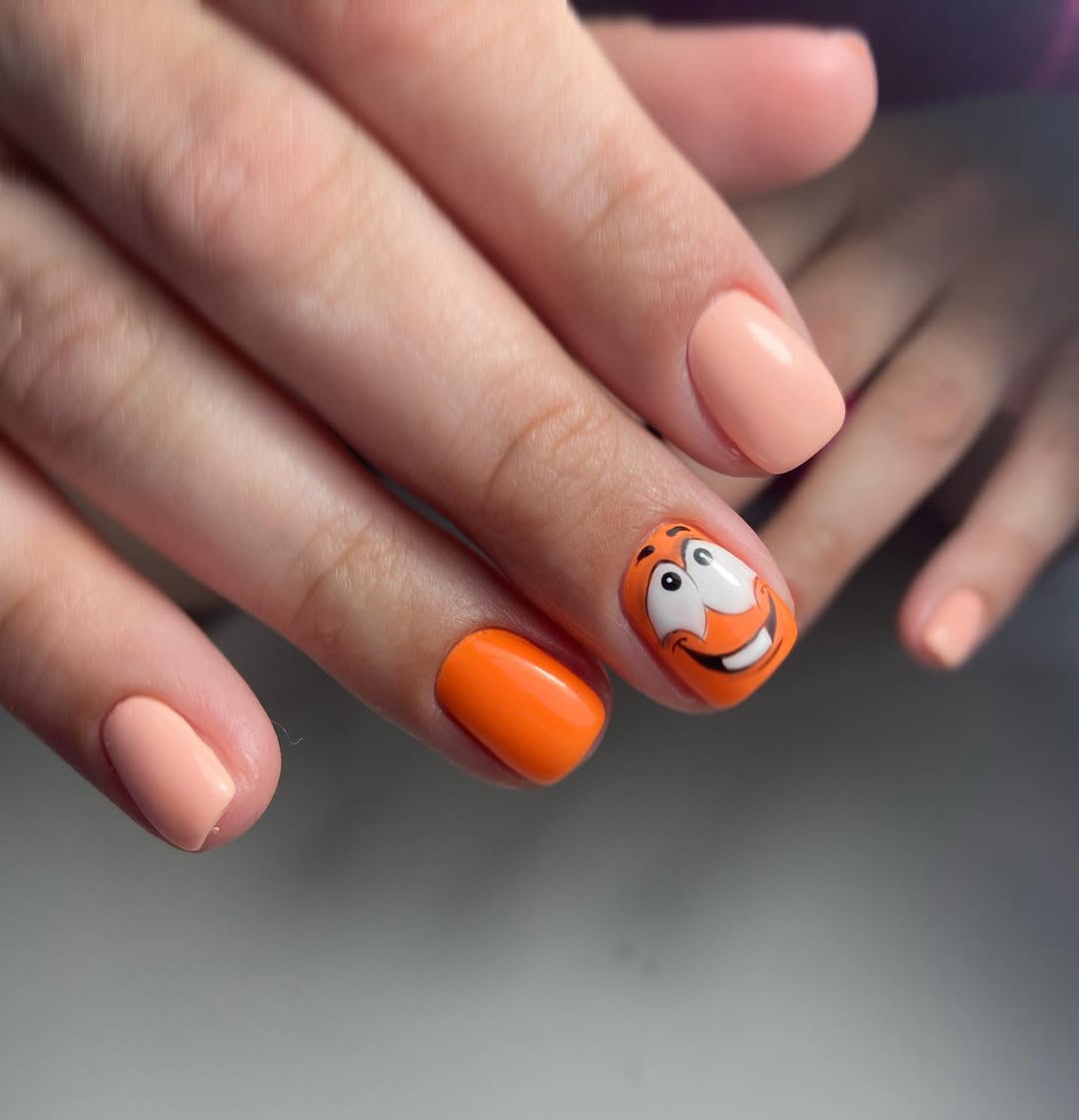 Playful Orange And Peach Cartoon Character Nails