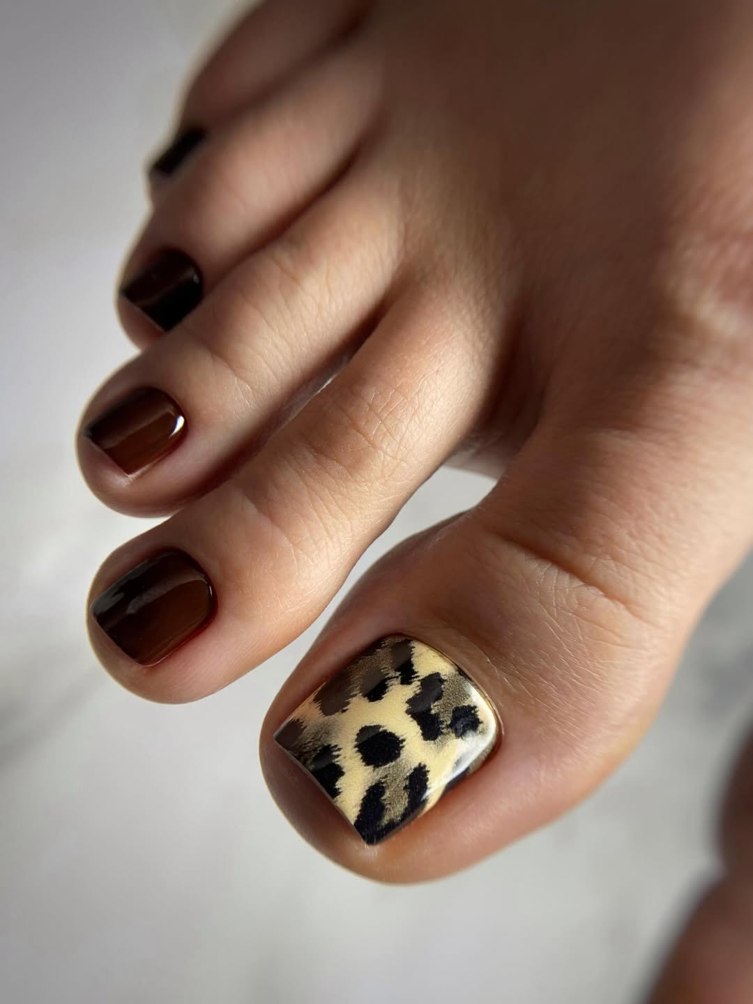 Rich Brown Pedicure with Leopard Print Accent