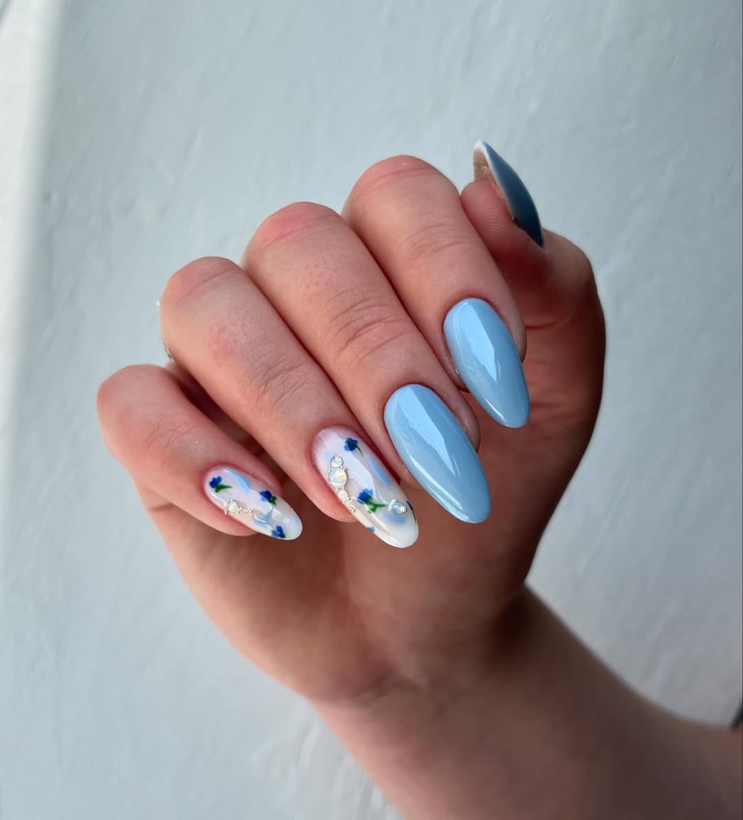 Sky Blue Floral Almond Nails with Delicate Rhinestones