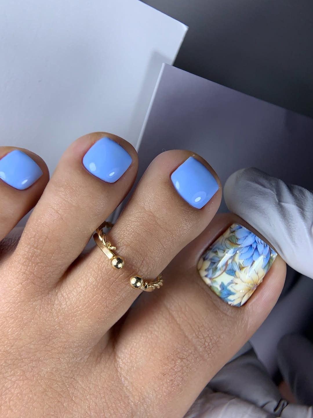 Sky Blue Glossy Pedicure with Floral Accent Toe