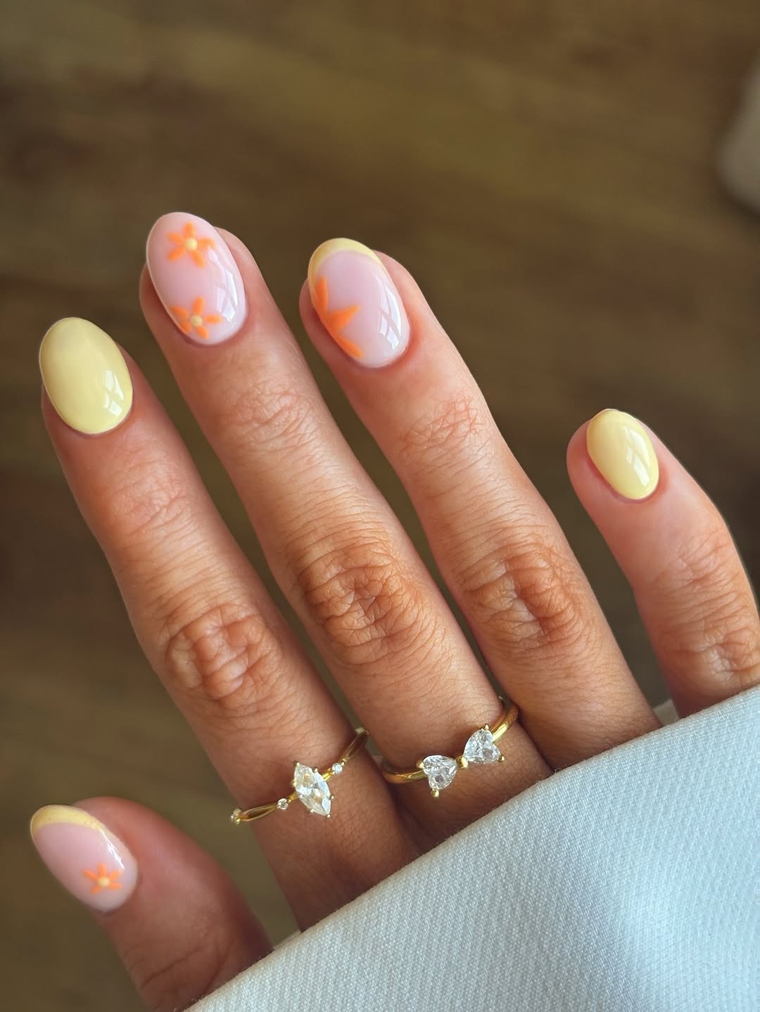 Soft Pink French Tips with Orange Floral Nail Art