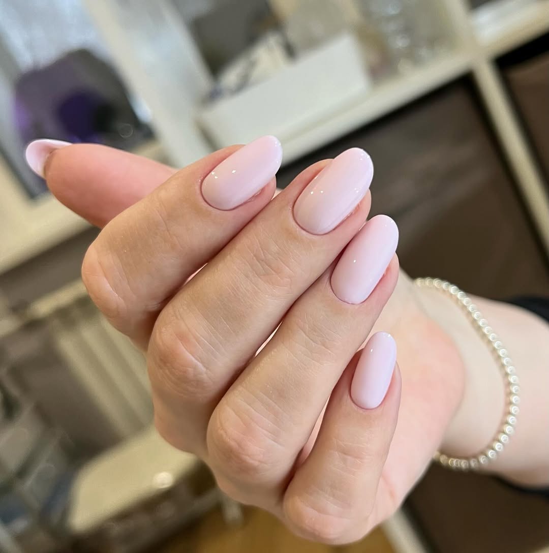 Soft Pink Glossy Almond Gel Nails