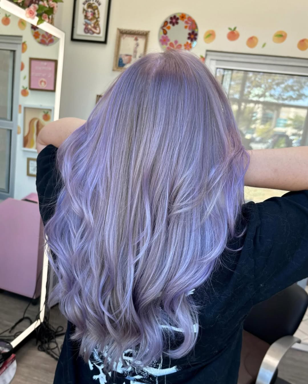 A beautiful woman with cool-toned, ash blonde hair showcasing a soft summer palette hair color for 2026. Perfect for a chic, everyday look.
