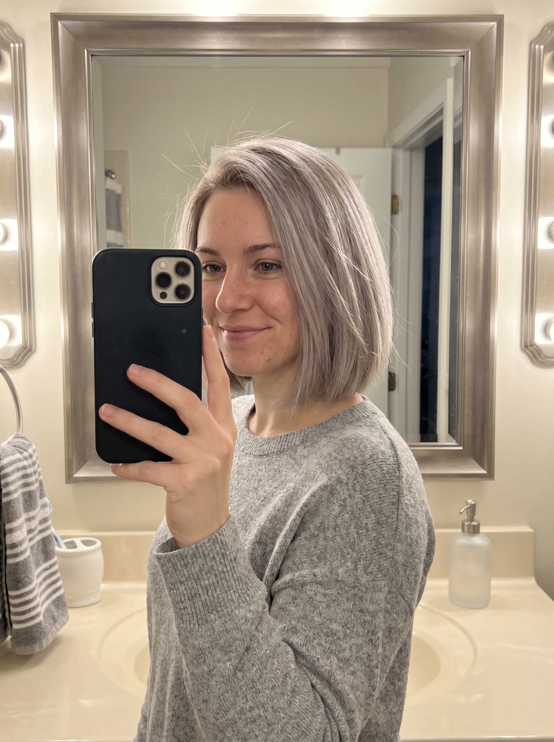 A chic Ash Pearl Scandi-Bob Gloss, ideal for a soft summer palette hair 2026, featuring iridescent grey and platinum sand tones for an ethereal, modern look suitable for everyday or special occasions.