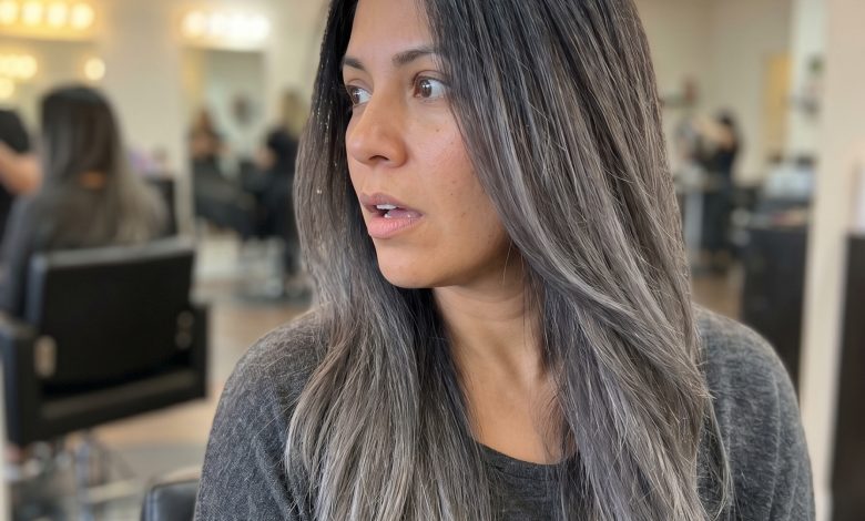 This edgy Soft Charcoal Ombre hair showcases the soft summer palette hair 2026 trend. Features deep charcoal roots blending to ash grey and silver mist ends, perfectly neutralized with purple shampoo for a modern, dramatic effect.