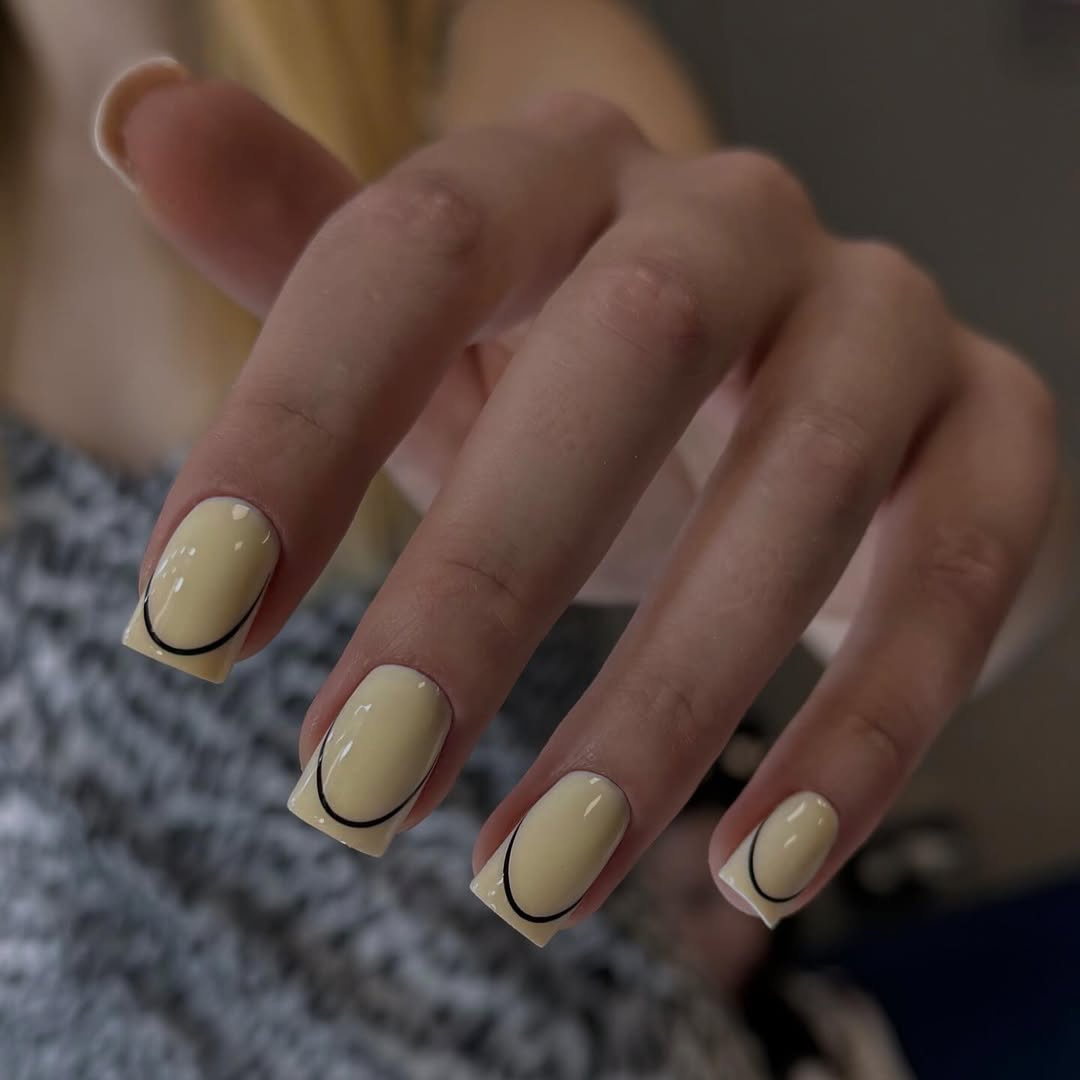Soft Yellow Coffin Nails With Black Outline French