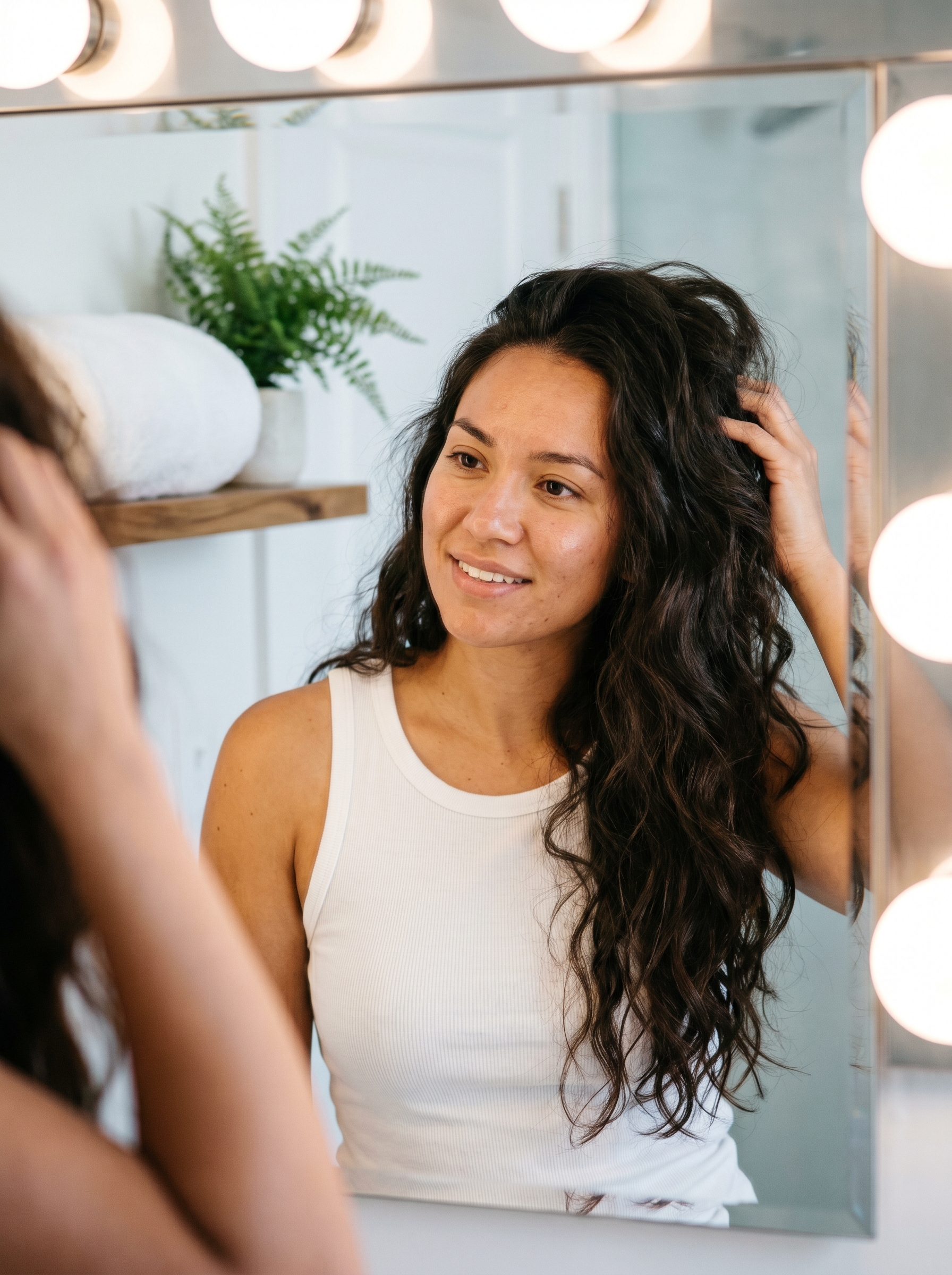 Cyber-Siren Glass Waves 2026: Edgy Glam Hair Glamorous cyber-siren glass waves look for a date night or resort party, featuring high-shine glossing serum and 'pinch' curls. Achieve stunning summer beachy waves hair 2026 with a futuristic twist.