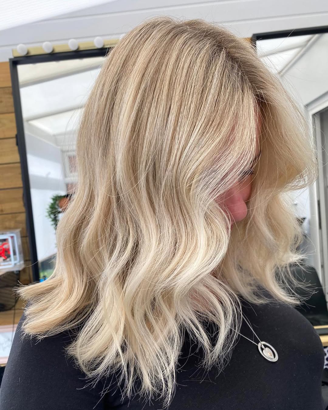 Perfect Summer Beachy Waves Hair 2026 Close-up of a woman with radiant, perfectly styled summer beachy waves hair 2026, showcasing defined texture and effortless volume, ideal for a casual day or evening out.