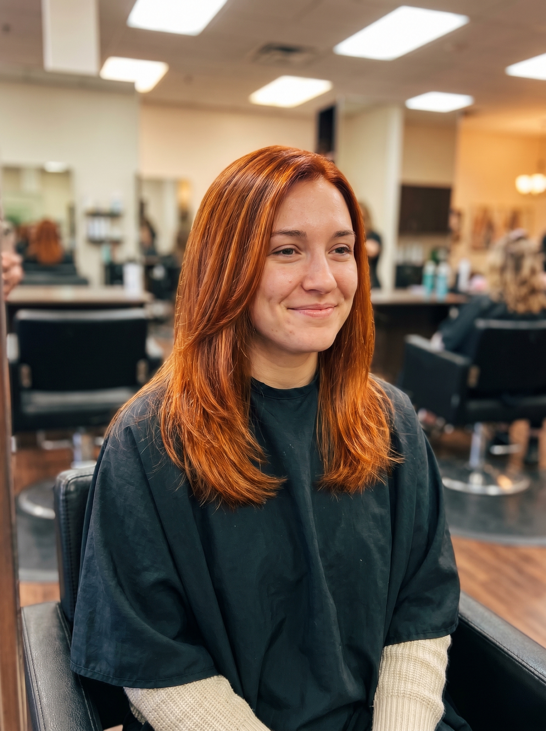 Vibrant Aperol Spritz copper hair gloss with blood orange, golden copper, and peach tones. A glamorous and cute summer hair color idea for 2026, great for night outs.