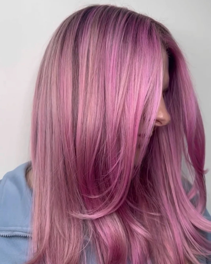 Close-up of a woman with vibrant copper-red hair styled in soft waves, showcasing a beautiful summer hair color cute ideas 2026. Perfect for a sunny day or outdoor event.