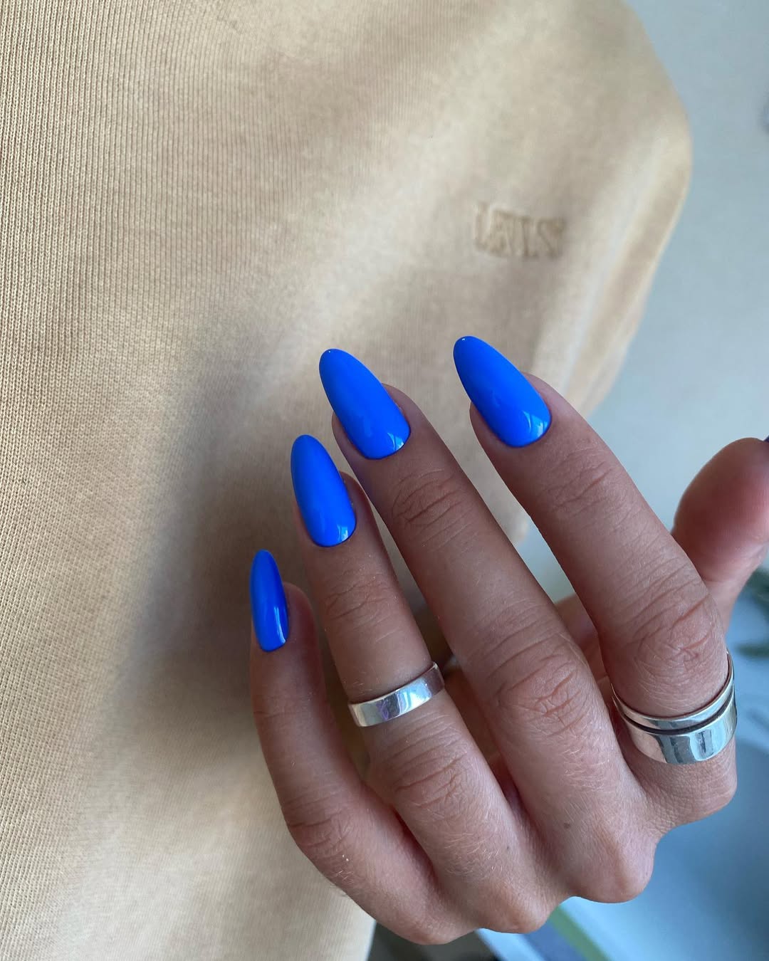Vibrant Blue Glossy Almond Nails