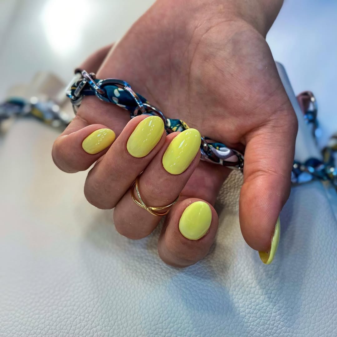 Vibrant Glossy Lemon Yellow Almond Nails