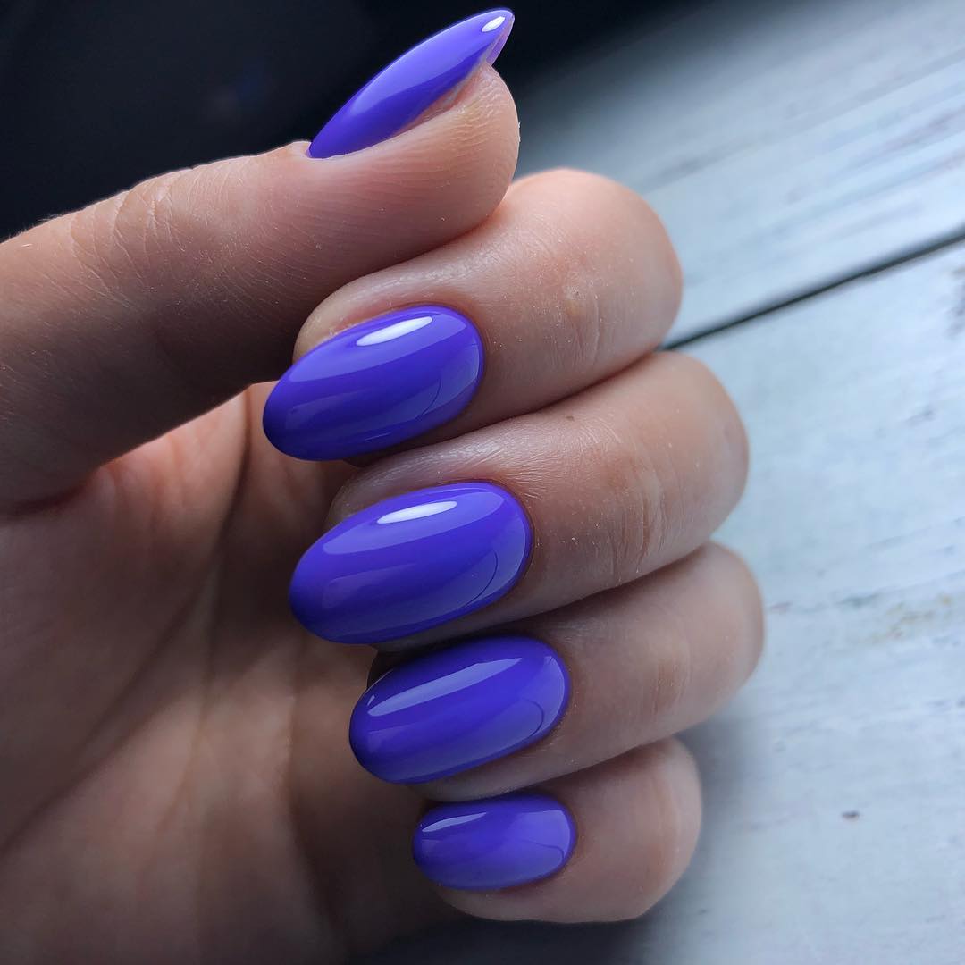 Vibrant Glossy Violet Oval Stiletto Nails