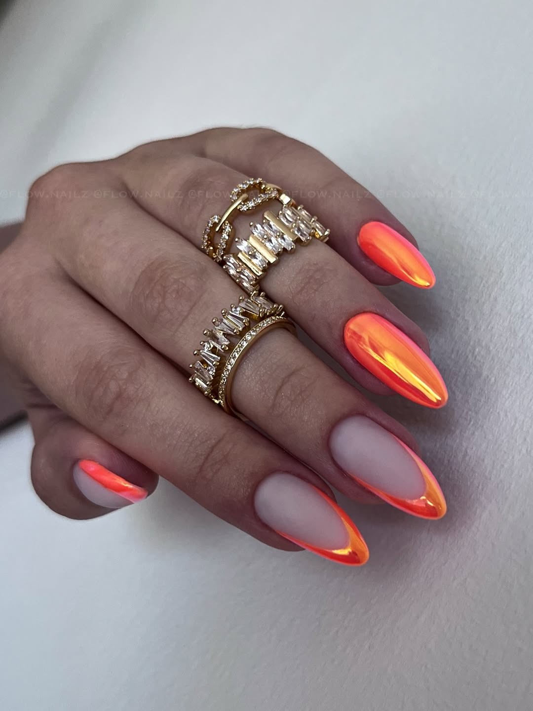 Vibrant Neon Orange Chrome French Tip Almond Nails